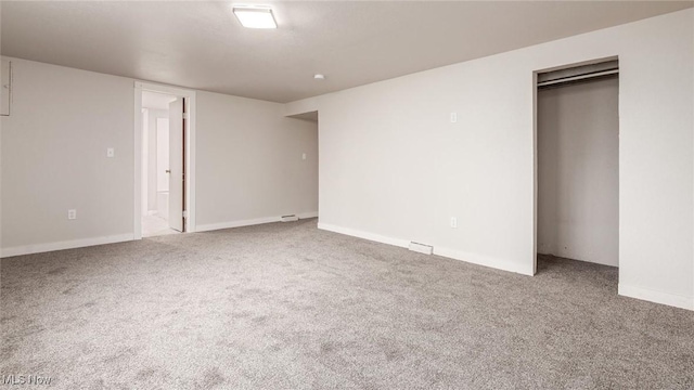 unfurnished bedroom featuring a closet and carpet floors