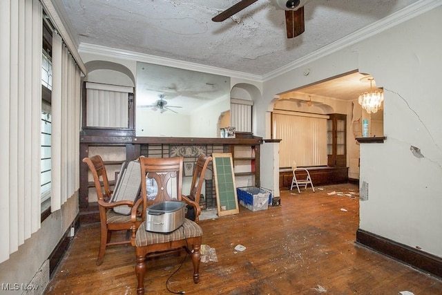 living room featuring a chandelier, hardwood / wood-style flooring, and ornamental molding