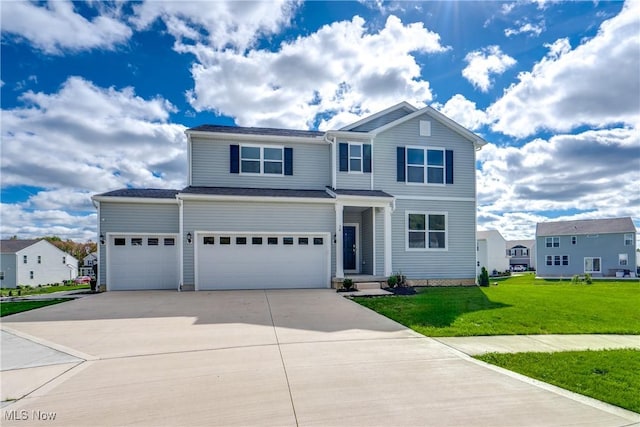 view of front of home with a garage and a front lawn