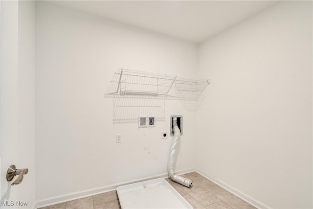 laundry room with electric dryer hookup, hookup for a washing machine, and light tile patterned floors