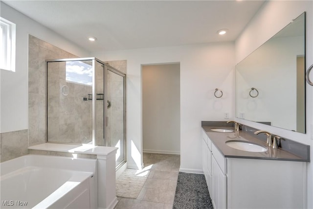 bathroom with vanity, tile patterned floors, and independent shower and bath