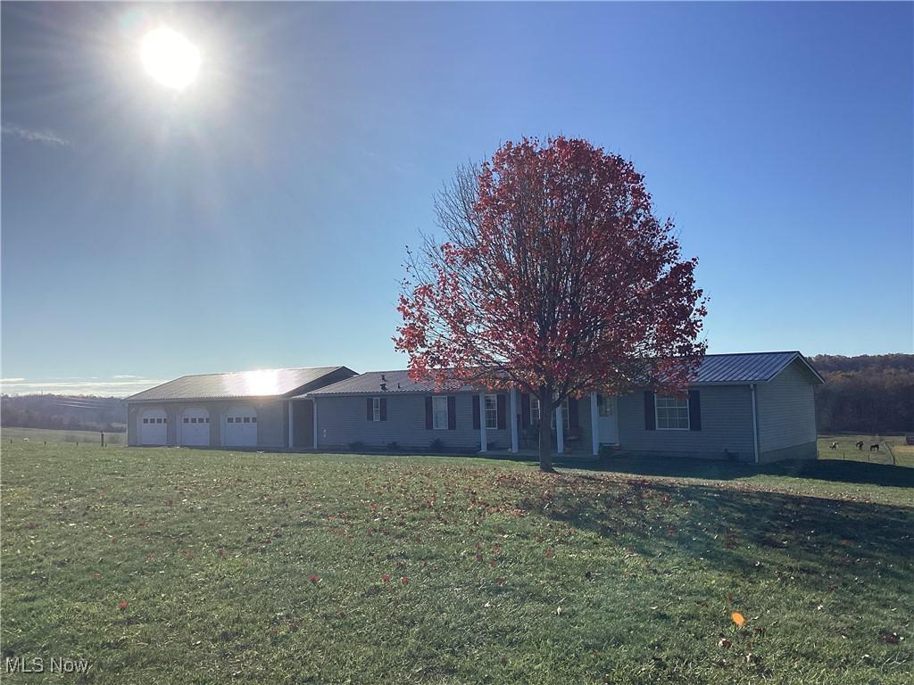 65236 Meeksville Rd, Mcarthur, OH 45651 - exterior space with a garage and a front yard