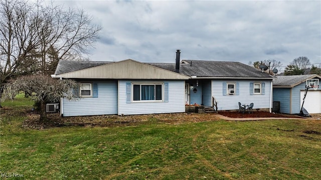 rear view of house with a yard