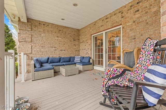 wooden terrace featuring an outdoor hangout area
