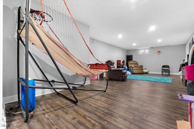 playroom featuring recessed lighting, wood finished floors, and baseboards