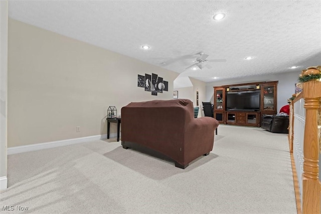 living area with recessed lighting, carpet flooring, ceiling fan, and baseboards