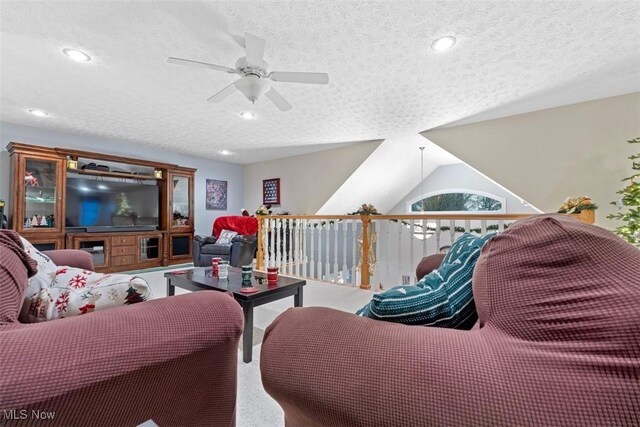 living area with recessed lighting, a textured ceiling, and ceiling fan