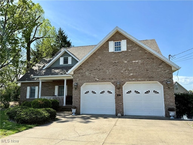 traditional-style home with driveway, an attached garage, a porch, and brick siding