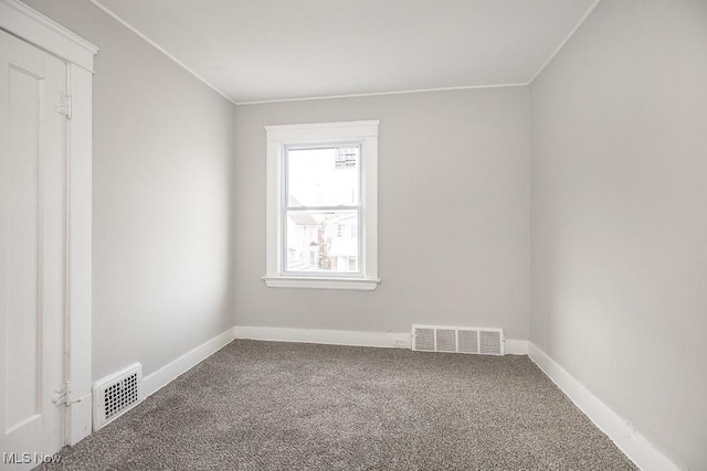 spare room featuring carpet