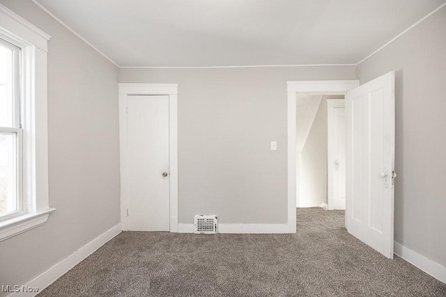 empty room featuring carpet floors