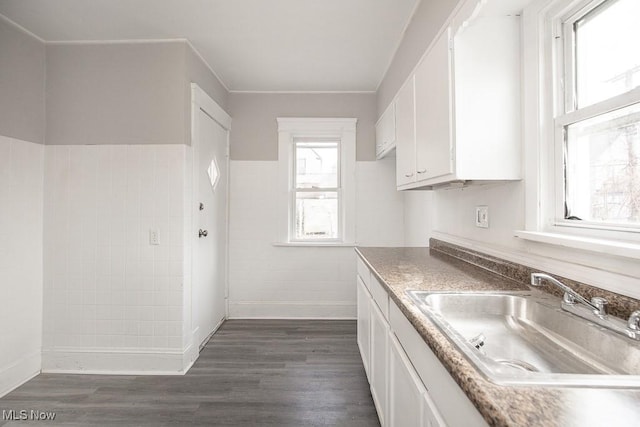 kitchen featuring white cabinetry, sink, and dark hardwood / wood-style floors