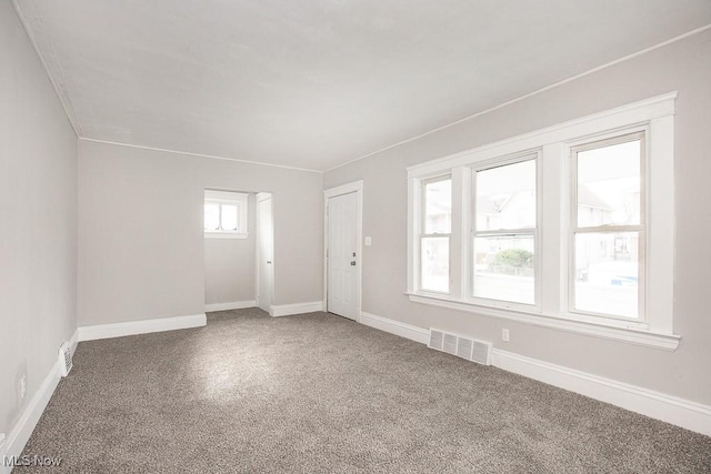 unfurnished room featuring carpet floors