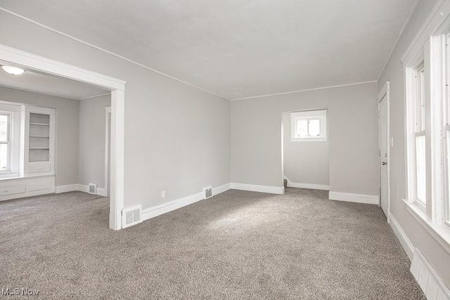 unfurnished room with carpet floors