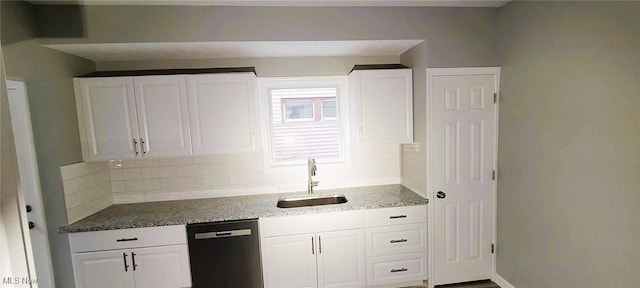 365 E 123rd St, Cleveland, OH 44108 - kitchen with stone counters, white cabinetry, dishwasher, sink, and backsplash