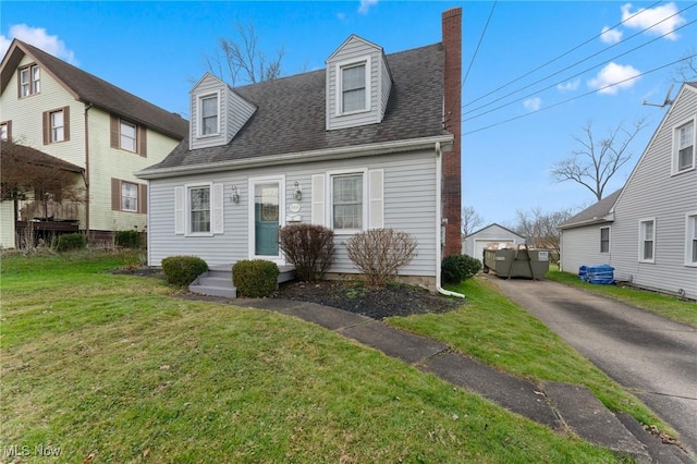 cape cod house featuring a front lawn