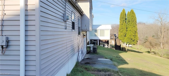 view of property exterior with a lawn