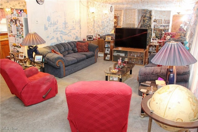 carpeted living room featuring a baseboard heating unit