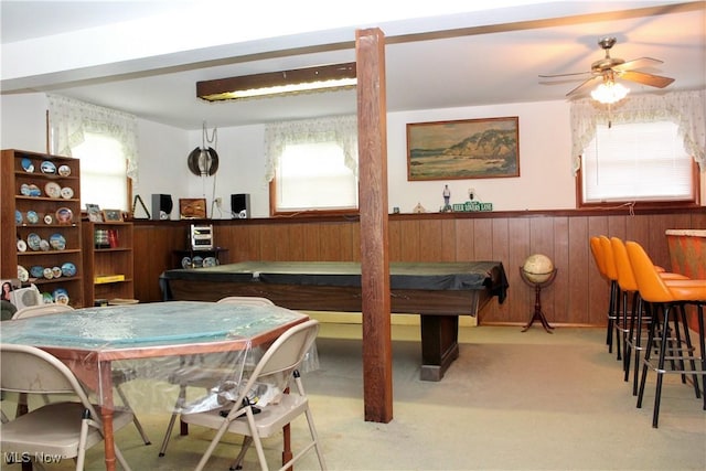 playroom featuring wood walls, ceiling fan, a healthy amount of sunlight, and billiards