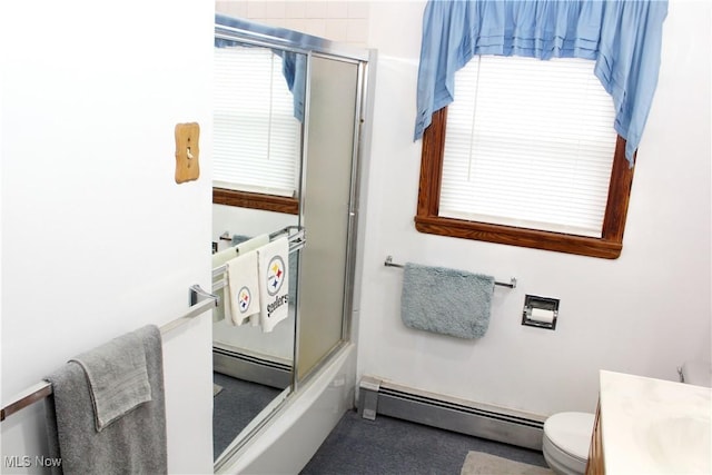 full bathroom with plenty of natural light, a baseboard radiator, and bath / shower combo with glass door