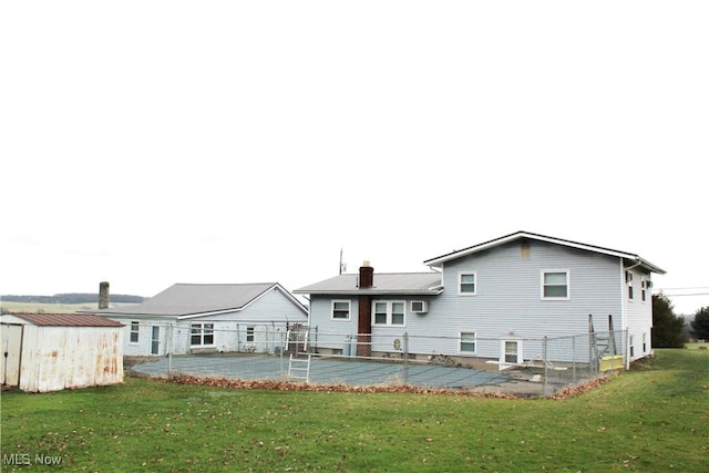 rear view of house with a yard