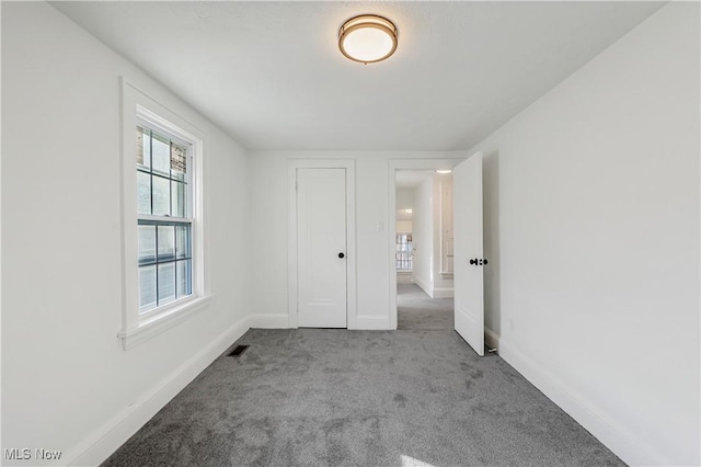 empty room featuring light colored carpet