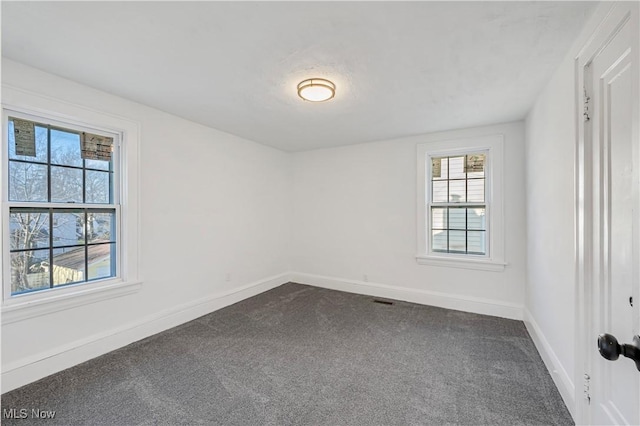 spare room featuring carpet floors