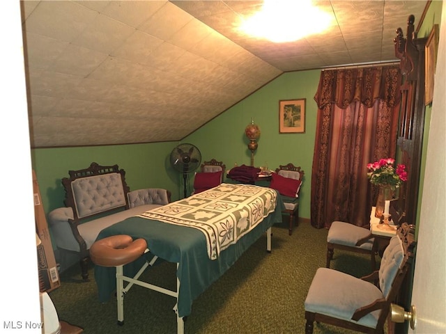 bedroom featuring carpet floors and vaulted ceiling