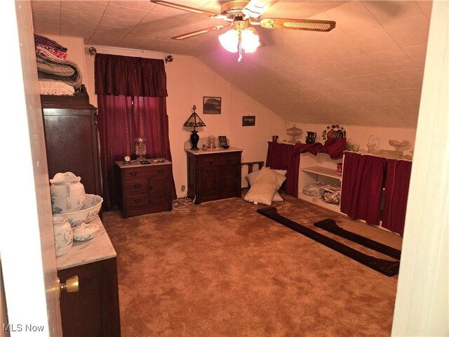 bedroom featuring carpet flooring, ceiling fan, and vaulted ceiling