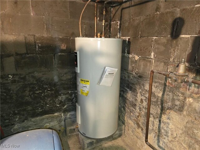 utility room featuring electric water heater