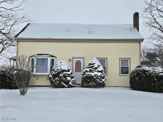 view of front of property with a chimney