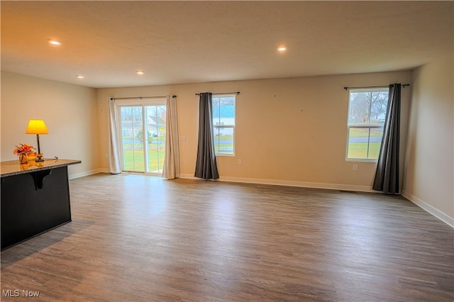 living room featuring dark hardwood / wood-style flooring and plenty of natural light