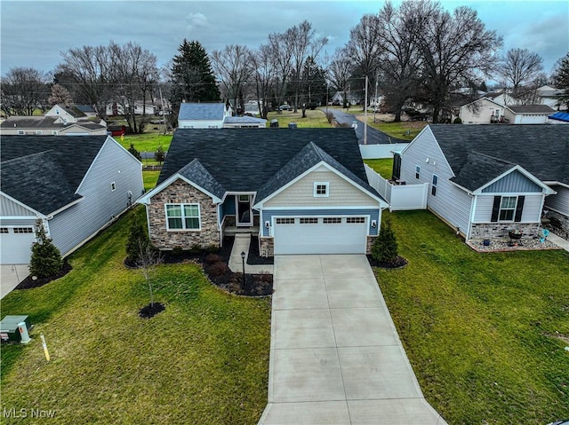 view of front facade with a garage and a front lawn