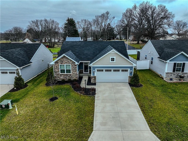 view of front facade with a front yard and a garage