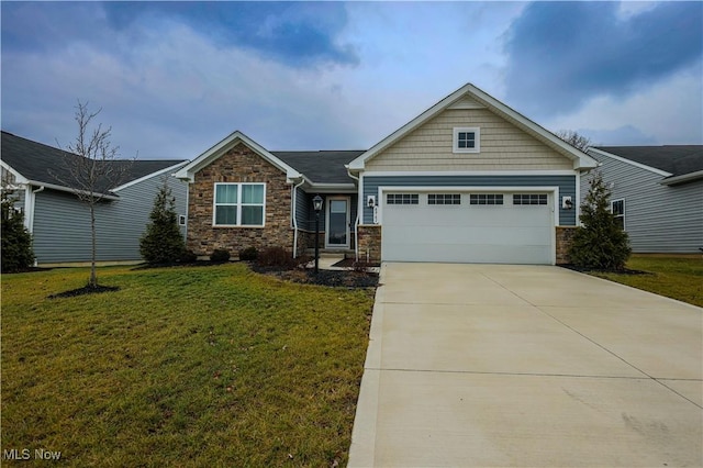 view of front of property with a garage and a front lawn