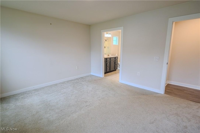 empty room featuring light colored carpet