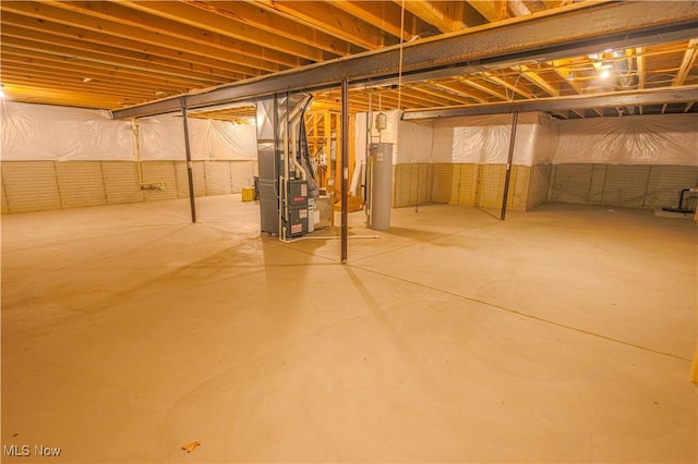 basement featuring heating unit and water heater