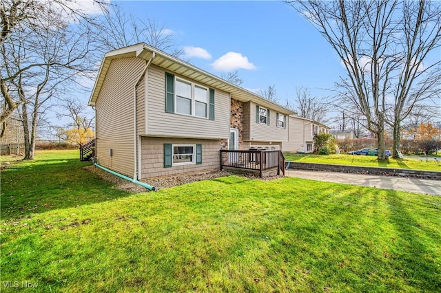 exterior space with a lawn and a wooden deck