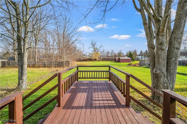 wooden deck featuring a yard