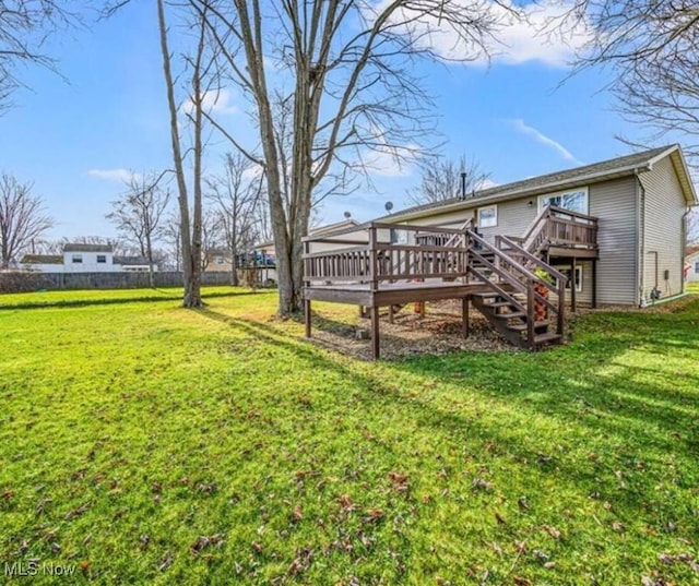 view of yard with a wooden deck