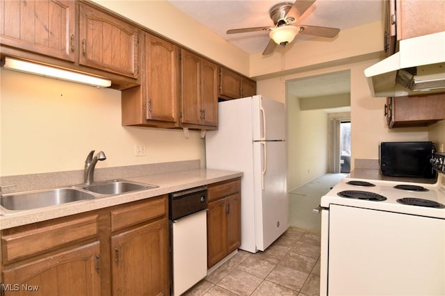 kitchen with white appliances, ceiling fan, exhaust hood, sink, and light tile patterned floors