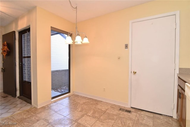 unfurnished dining area with an inviting chandelier