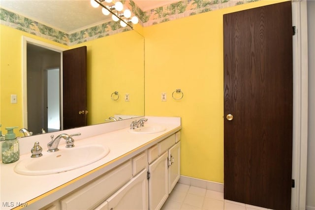 bathroom with a textured ceiling, vanity, and tile patterned floors