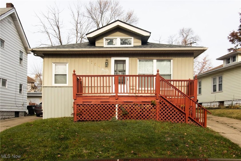 view of front of home with a front yard and a porch