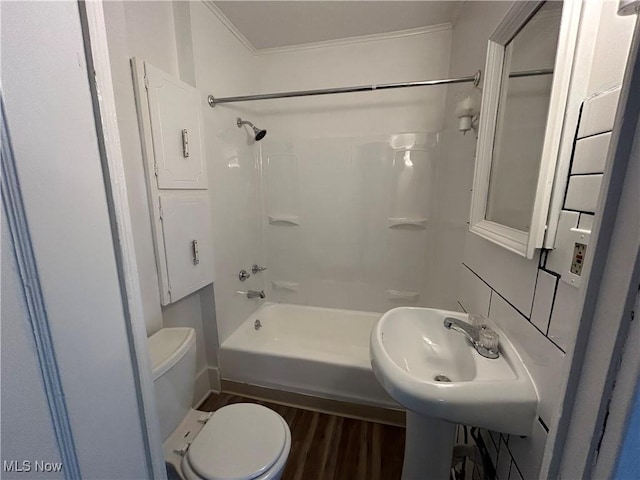 full bathroom with hardwood / wood-style flooring, sink, toilet, and bathtub / shower combination