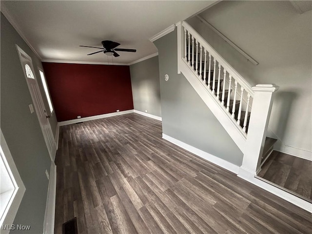 unfurnished living room with ornamental molding, dark hardwood / wood-style floors, and ceiling fan