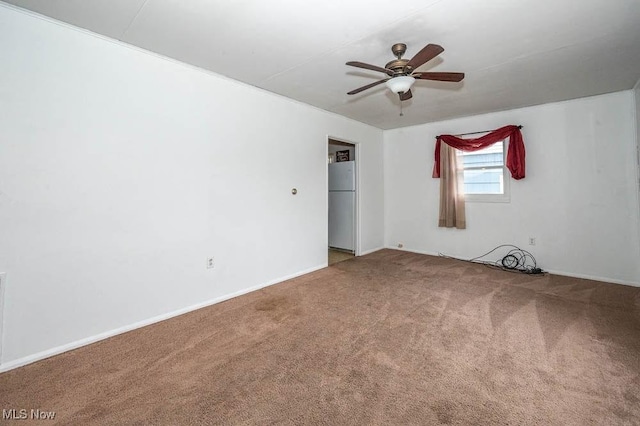 carpeted empty room with ceiling fan