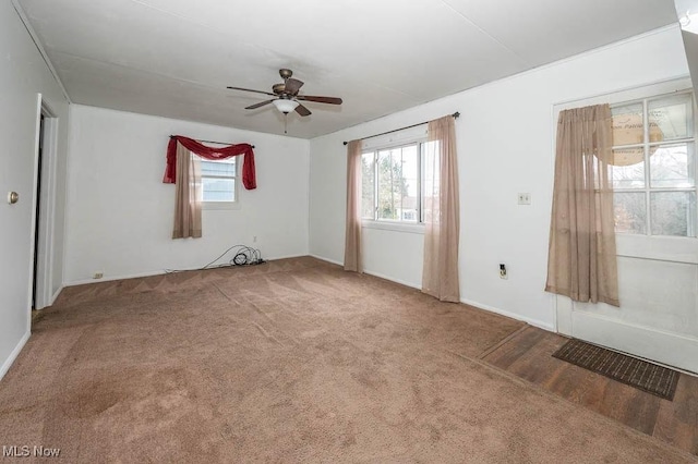 spare room with carpet and ceiling fan