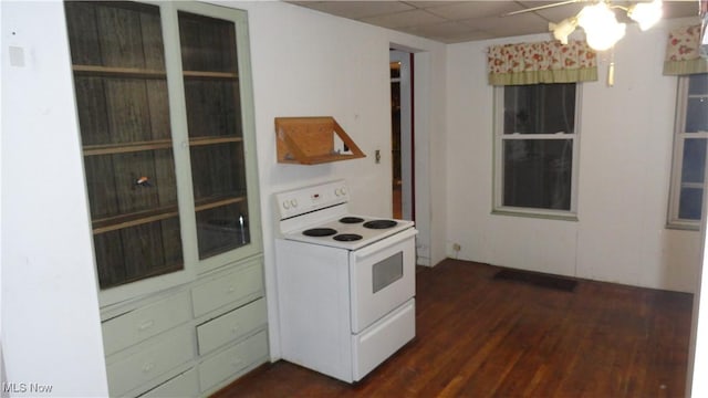 kitchen with a paneled ceiling, dark hardwood / wood-style floors, white range with electric cooktop, and ceiling fan