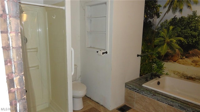 bathroom with tile patterned flooring, toilet, and independent shower and bath