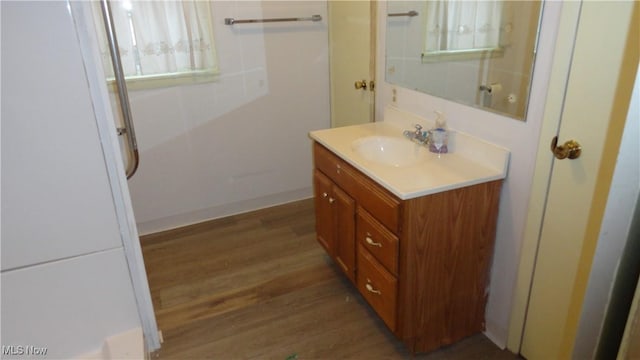 bathroom with hardwood / wood-style floors and vanity